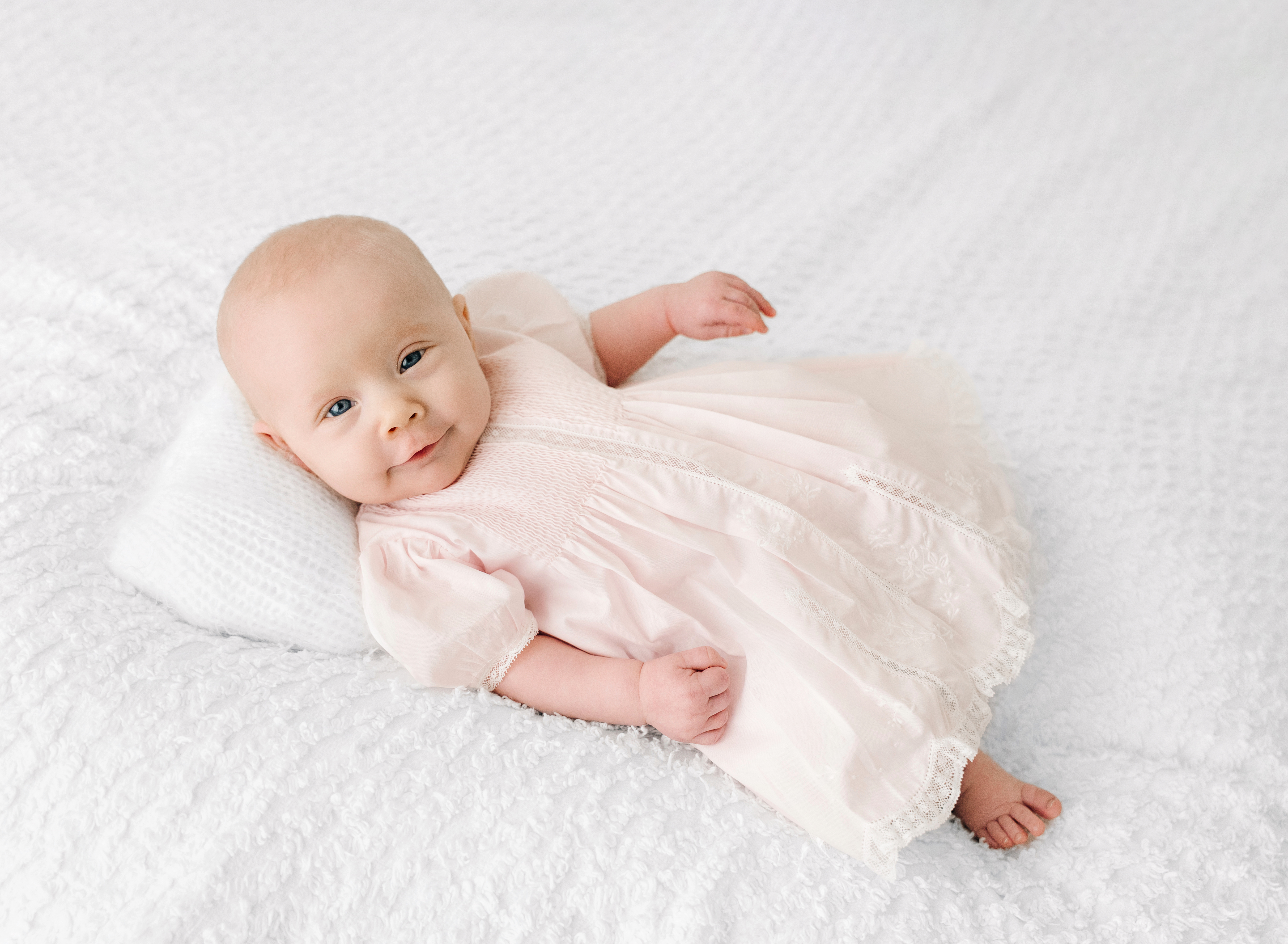 photo of baby on blanket